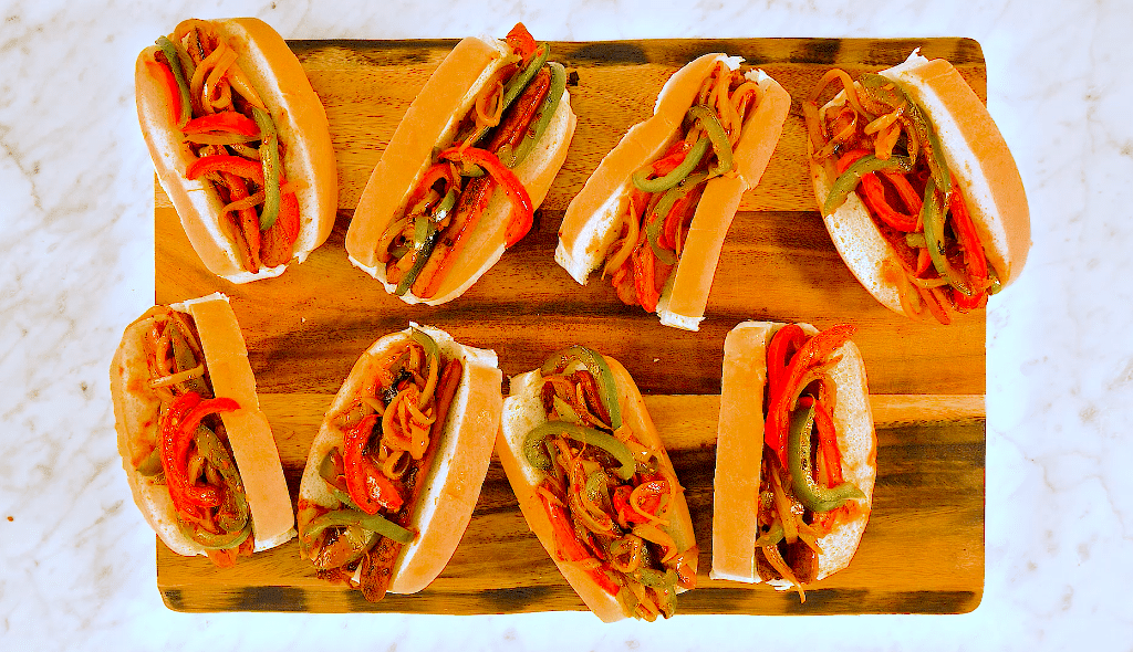 Hot dogs with sweet onion and capsicum relish