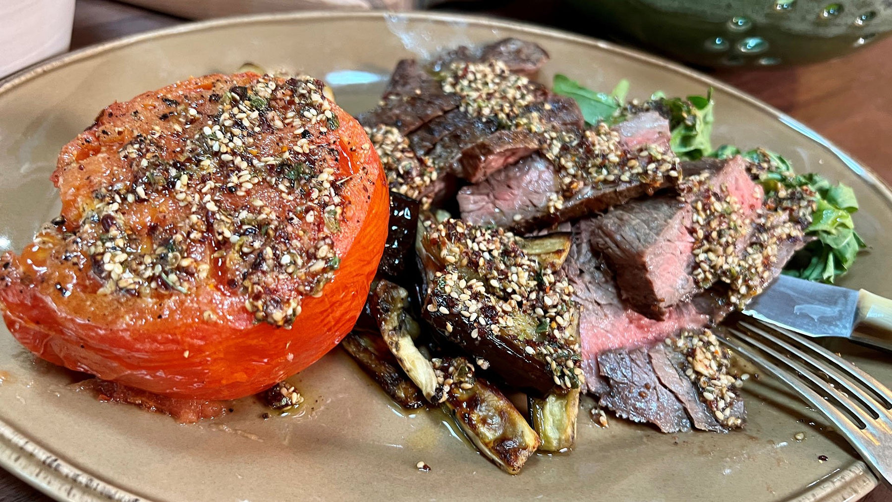 Beef Steaks with Za'atar Dressing, Roasted Tomatoes and Eggplant, Greens with Olive Oil and Lemon