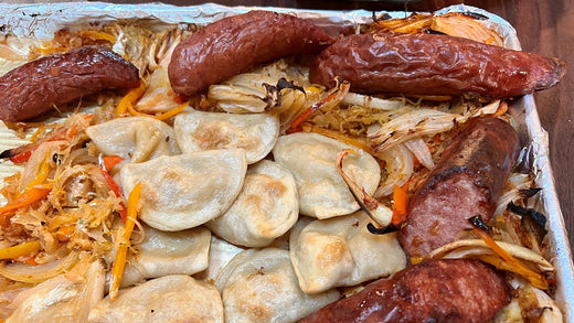 Kielbasa and Pierogi Tray Bake with Sauerkraut, Sweet Peppers, Onions and Dijon Sour Cream Sauce