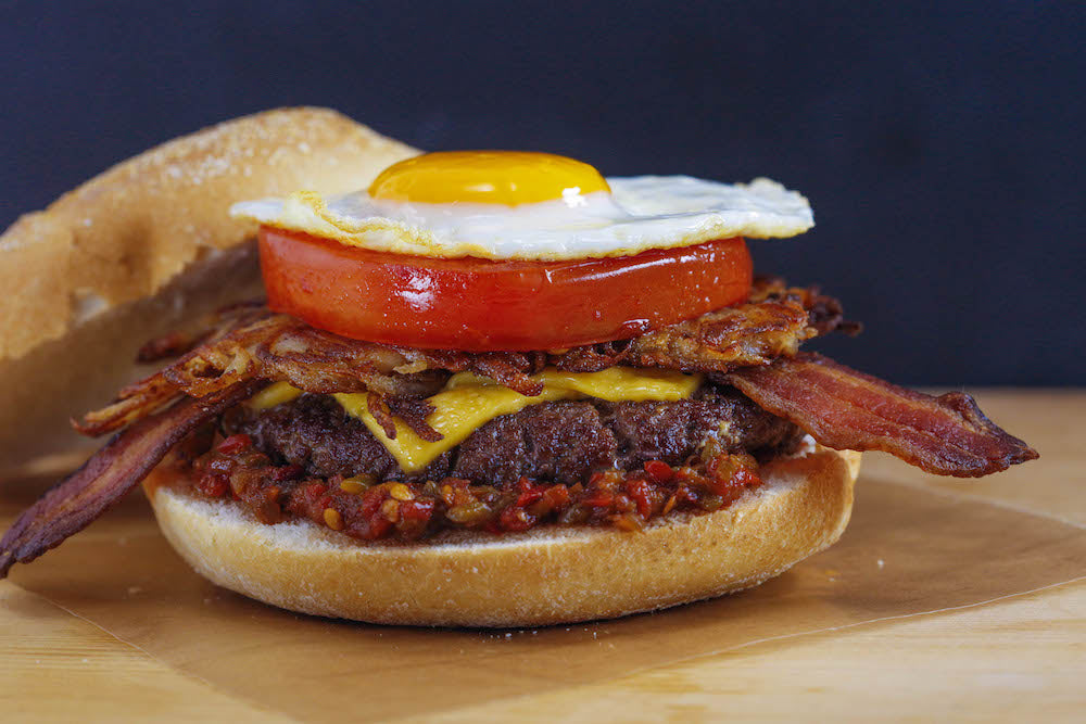 Bacon, Egg and Cheeseburger on a Roll with Spicy Mustard Hash Browns
