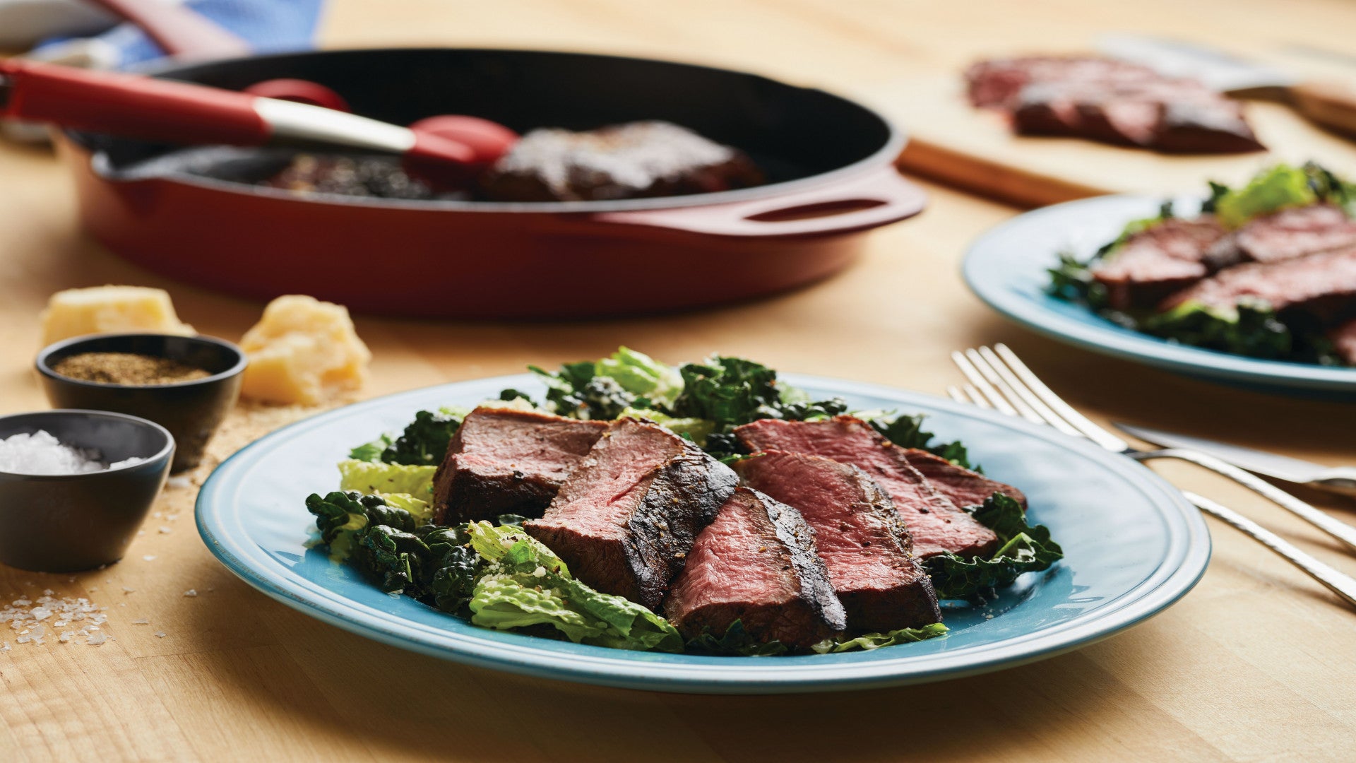 Sliced Steaks with Kale Caesar Salad