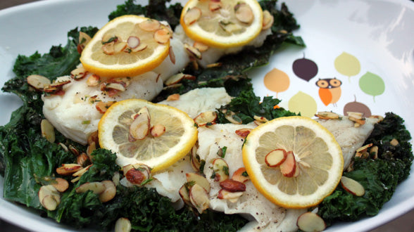 Branzino with Brown Butter and Almonds on a Bed of Crispy Kale