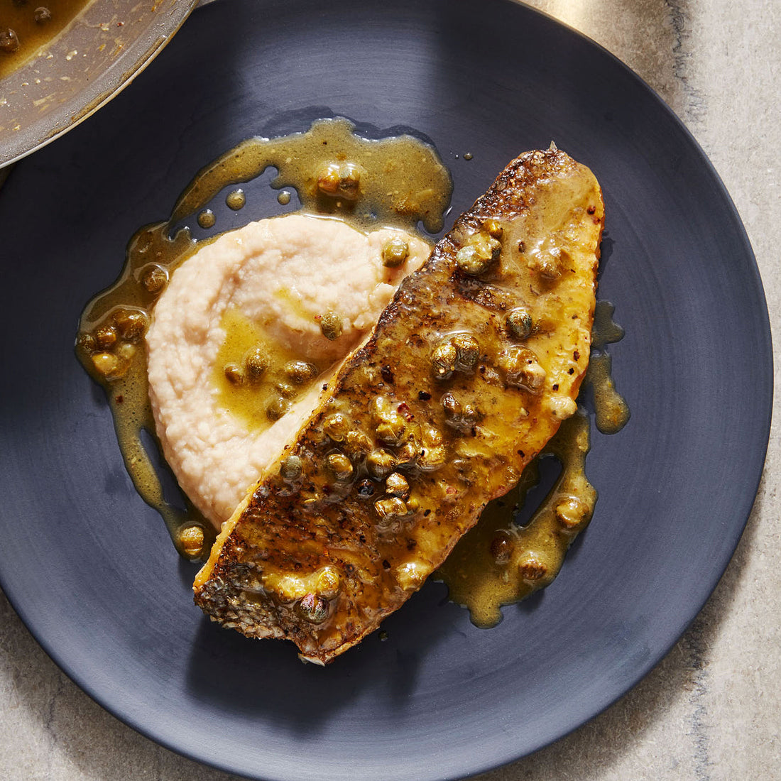 Rachael Ray's Crispy-Skin Branzino with Brown Butter & Caper Sauce on White Bean Puree