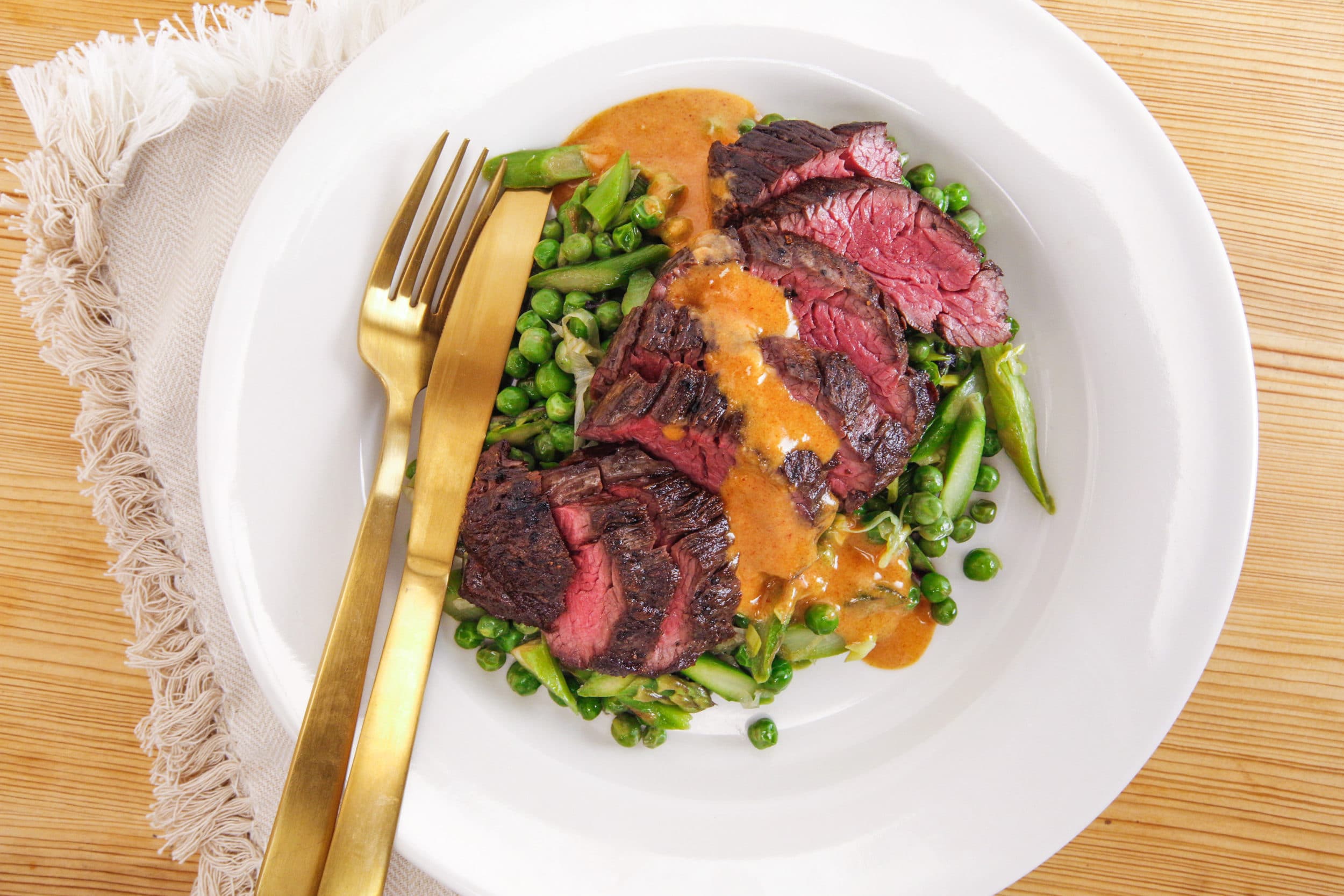Rachael's Sliced Hanger Steak with Smoky Mustard Dressing and Spring Vegetables with Shallots and Greens