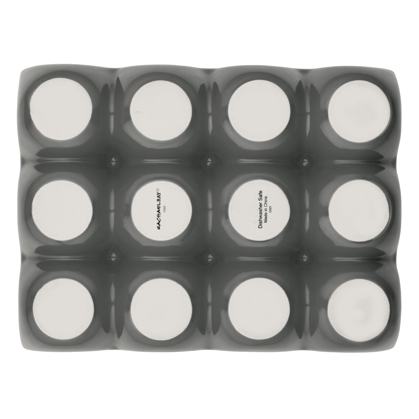 Twelve round containers in a black tray viewed from above.
