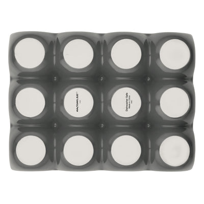 Twelve round containers in a black tray viewed from above.