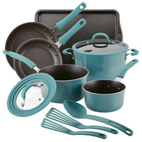 Cookware set with pots, pans, lids, spatulas, and a baking sheet.