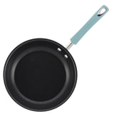 Non-stick frying pan with a light blue handle.