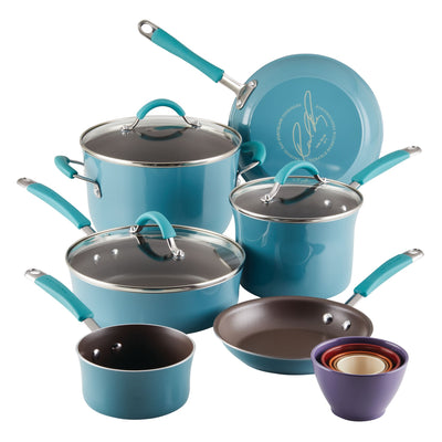 A set of blue cookware and colorful mixing bowls on display.