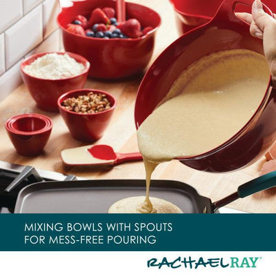 Mixing bowl pouring batter onto a griddle, surrounded by ingredients.