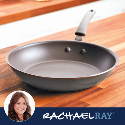 Non-stick frying pan on a wooden counter, Rachael Ray branding visible.