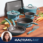 Cookware set with blue handles and diverse vegetables on a wooden surface.
