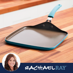 Square griddle with a teal handle on a wooden countertop.