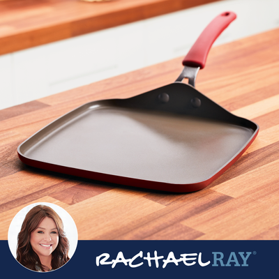 Red-handled square griddle pan on a wooden countertop.