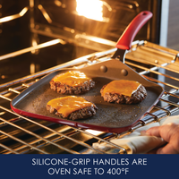 Burgers with cheese on a pan in an oven; silicone-grip handle visible.