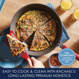 A frittata in a pan with a slice being lifted, next to two glasses of juice.