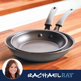 Two nonstick frying pans on a wooden countertop, Rachael Ray branding shown.