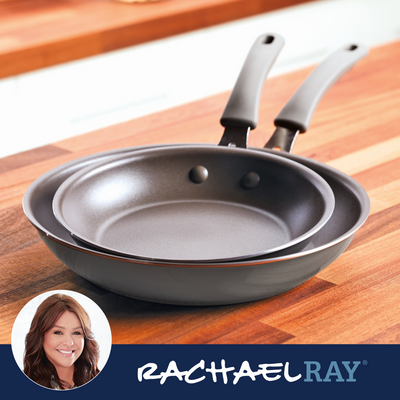 Two nonstick frying pans on a wooden countertop, Rachael Ray branding shown.