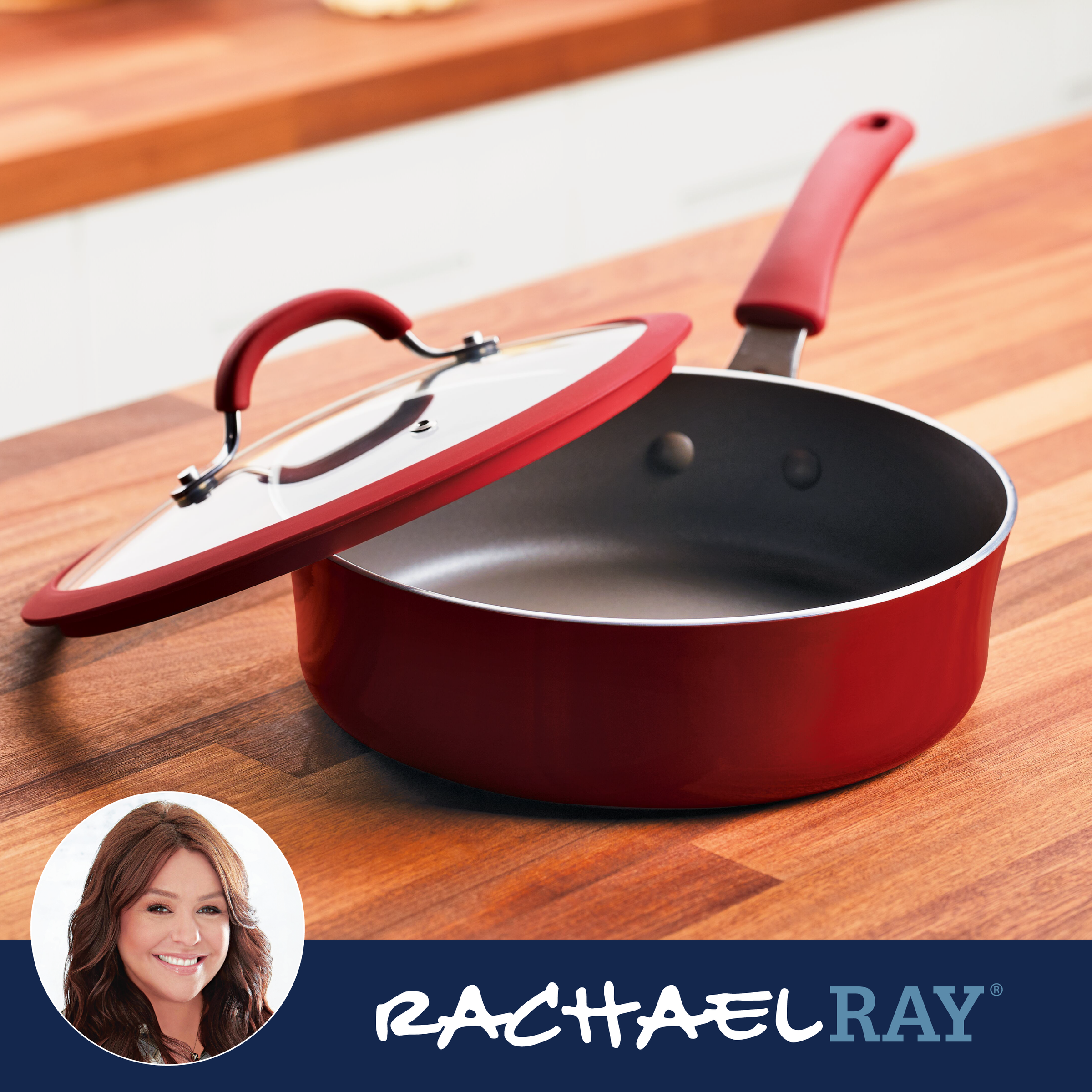 Red saucepan with lid on wooden countertop, Rachael Ray branding visible.