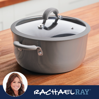 Gray pot with a glass lid on a wooden surface; Rachael Ray logo shown.