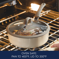Pan with glass lid in an oven, labeled with heat safety information.
