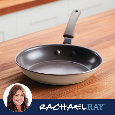 Nonstick frying pan on a wooden counter with Rachael Ray branding.