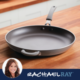 A nonstick frying pan with a handle on a wooden kitchen countertop.