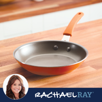 Orange frying pan on a wooden counter with Rachael Ray branding.