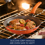 Orange-handled frying pan with chicken and vegetables in the oven.