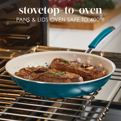 Frying pan with cooked meat, mushrooms, and herbs in an oven.