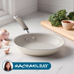 Ceramic frying pan on counter with garlic, greens, and spices nearby.