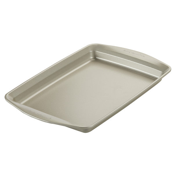 This piece from the 10-Piece Nonstick Bakeware Set, a rectangular metal baking sheet crafted from heavy gauge steel with raised edges, is set against a white background.