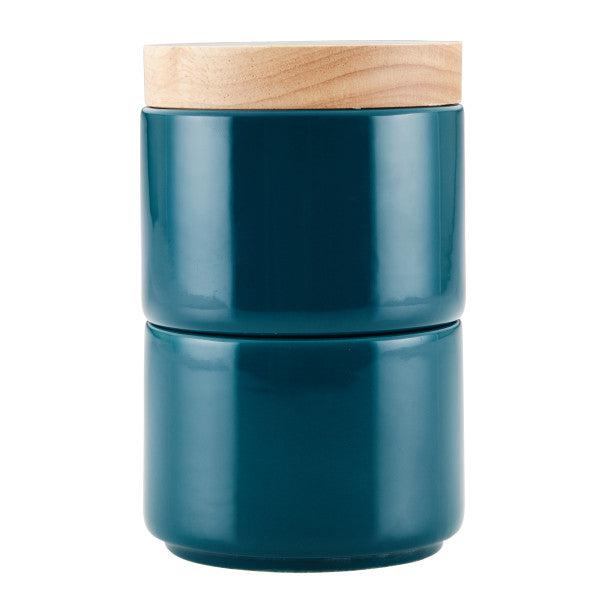 Dark teal ceramic jar with a light wooden lid, ideal for organizing spices. This stylish piece from the Stacking Spice Box Set is designed to integrate seamlessly with your other stacking containers.