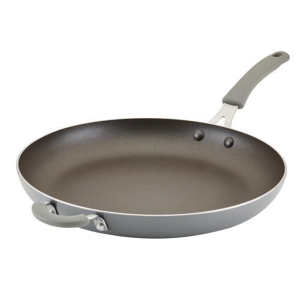 The Cook + Create Nonstick Frying Pan is a high-performance kitchen tool crafted from thicker gauge aluminum, complemented by a sleek gray handle.