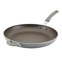 The Cook + Create Nonstick Frying Pan is a high-performance kitchen tool crafted from thicker gauge aluminum, complemented by a sleek gray handle.