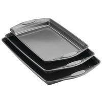 The 3-Piece Nonstick Sheet Pan Set is crafted from durable steel and includes three stacked baking sheets with rubberized grips, all of which are perfectly oven safe.