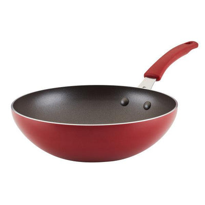 Red frying pan with a non-stick interior and a curved handle.