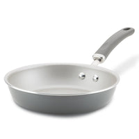 Non-stick frying pan with a grey handle on a white background.