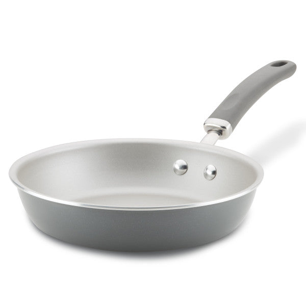 Non-stick frying pan with a grey handle on a white background.