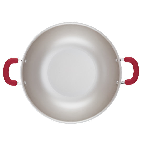Top view of a 14.25-inch nonstick induction wok with red handles.