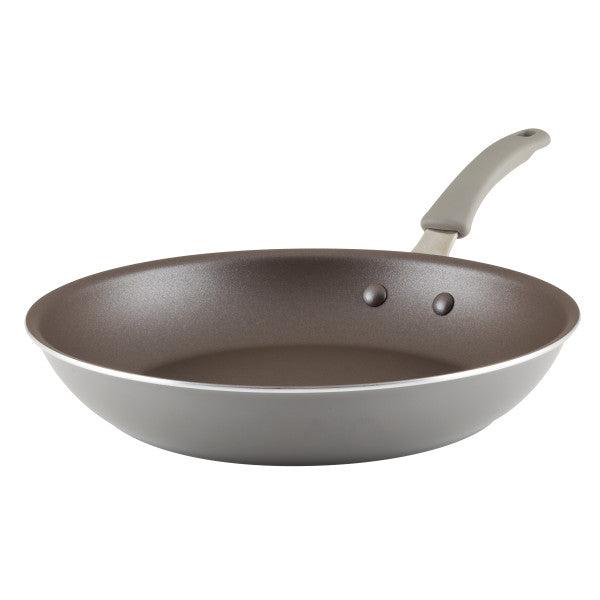 Side view of the Cook + Create Nonstick Frying Pan in gray, designed with high-performance thicker gauge aluminum and featuring a sturdy handle.