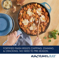 A pan of saucy pasta with melted cheese in a 12-Inch NITRO Cast Iron Skillet, accompanied by a wooden spoon on a table setting.
