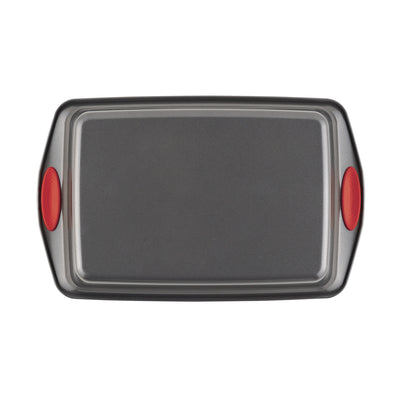 Rectangular baking sheet with red silicone handles.