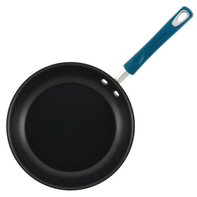 Non-stick frying pan with a blue handle, viewed from above.