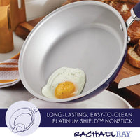 A fried egg cooks in a 13-Piece Nonstick Induction Cookware Set frying pan.
