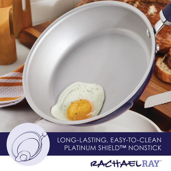 A fried egg cooks in a 13-Piece Nonstick Induction Cookware Set frying pan.
