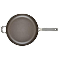 Cook + Create Nonstick Frying Pan, featuring a high-performance nonstick surface and a gray handle, crafted from thicker gauge aluminum and viewed from above.