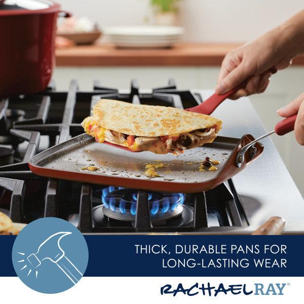 A person deftly flips a quesadilla on the 11-Inch Cook + Create Nonstick Square Griddle Pan, showcasing excellent stovetop performance over the gas stove burner.