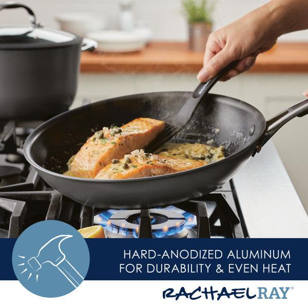 Cooking salmon in a Cook + Create Hard Anodized Nonstick Frying Pan with its hard-anodized aluminum construction on the stovetop ensures even heat distribution and effortless release.