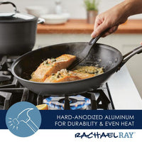 Cooking salmon in a Cook + Create Hard Anodized Nonstick Frying Pan with its hard-anodized aluminum construction on the stovetop ensures even heat distribution and effortless release.